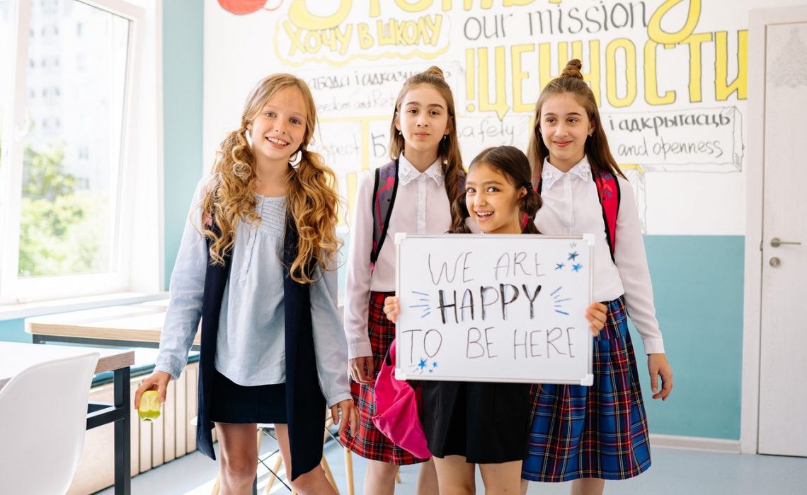 A Four Happy Girls in the Classroom