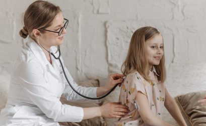 A Doctor Checking-Up the Girl Using Stethoscope