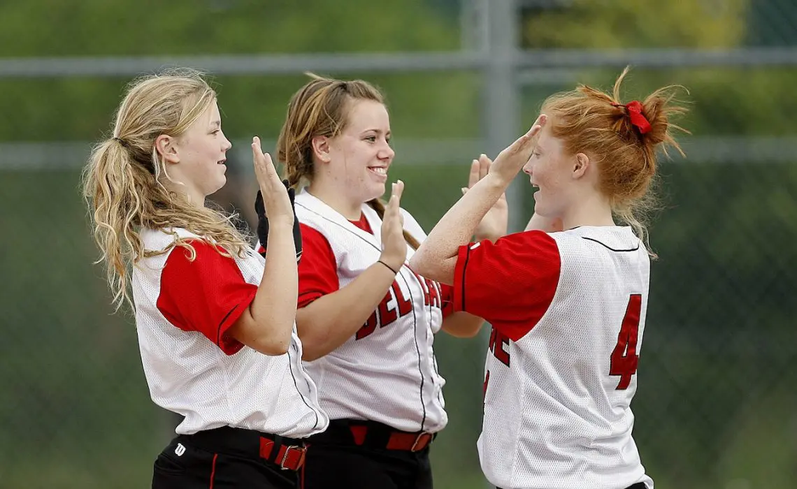 Girls on White Red Jersey Playing Hand Game