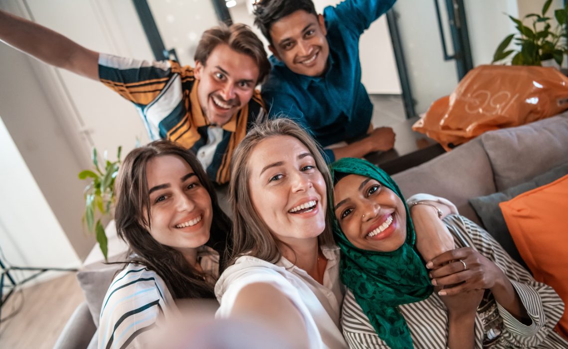 Group of people during a break from the work taking selfie picture