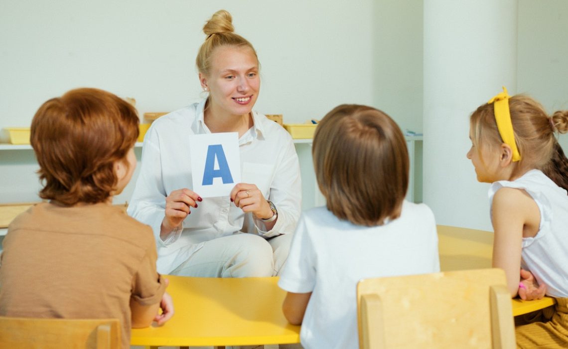 Teach in class showing students about letters