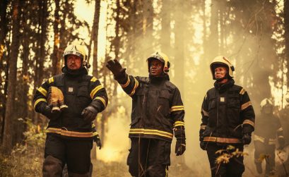 rtrait of a Diverse Group of Brave Wildfire Hotshots Walking in a Smoke-Filled Forest,