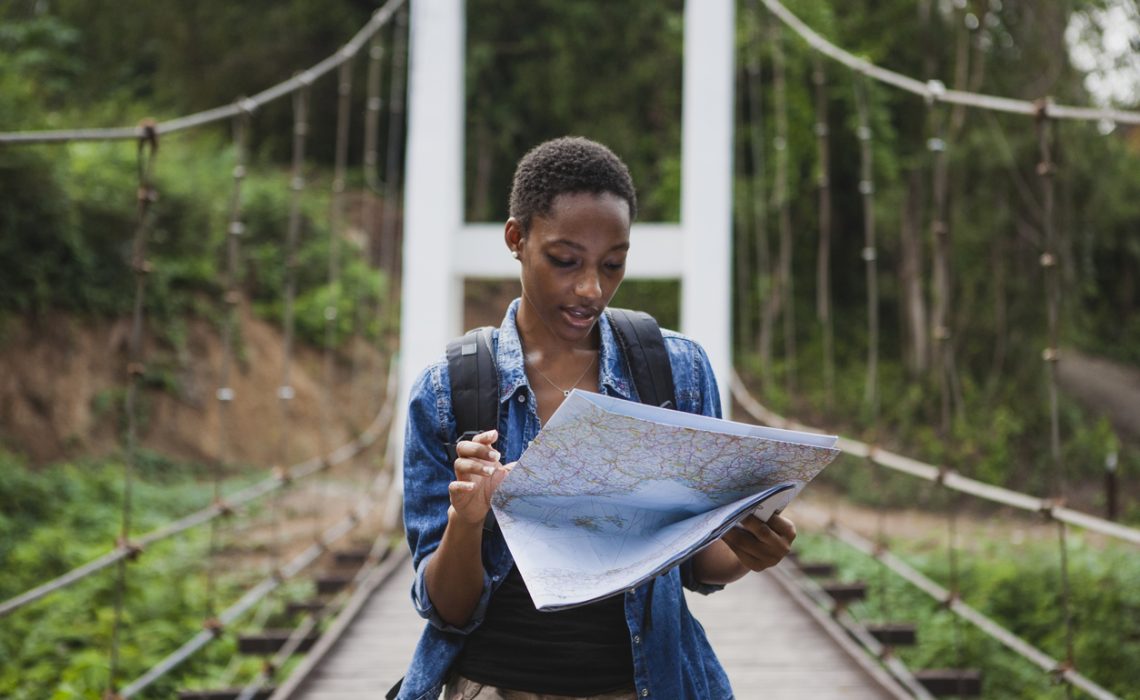African American woman looking at a map