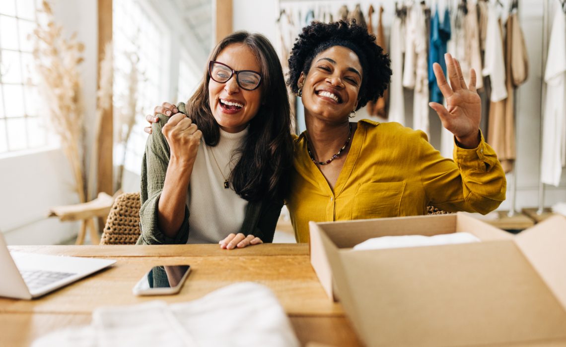 Female ecommerce business owners celebrating their success