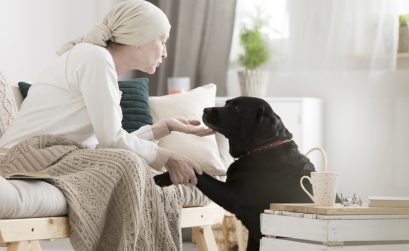 Tumor patient caressing her dog